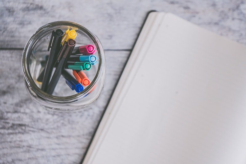 jar filled with pens