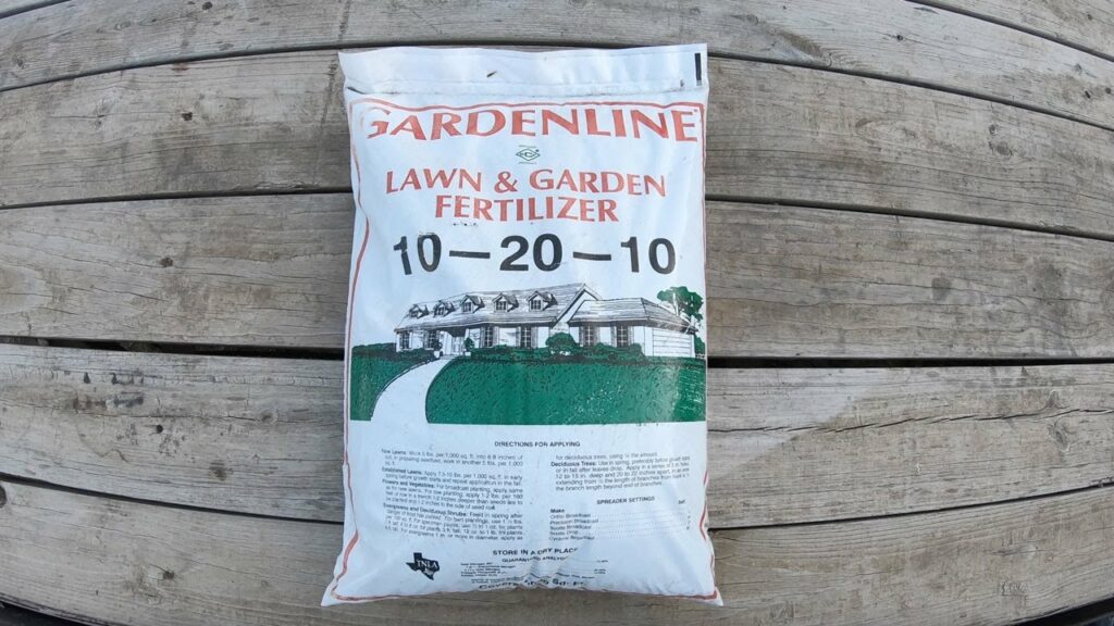 A bag of Gardenline fertilizer on a deck. 