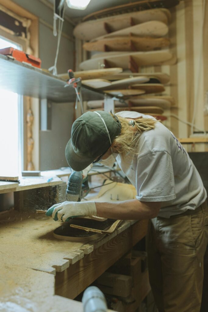 Man crafting wood using tools from ACE hardware rentals for a home improvement project.